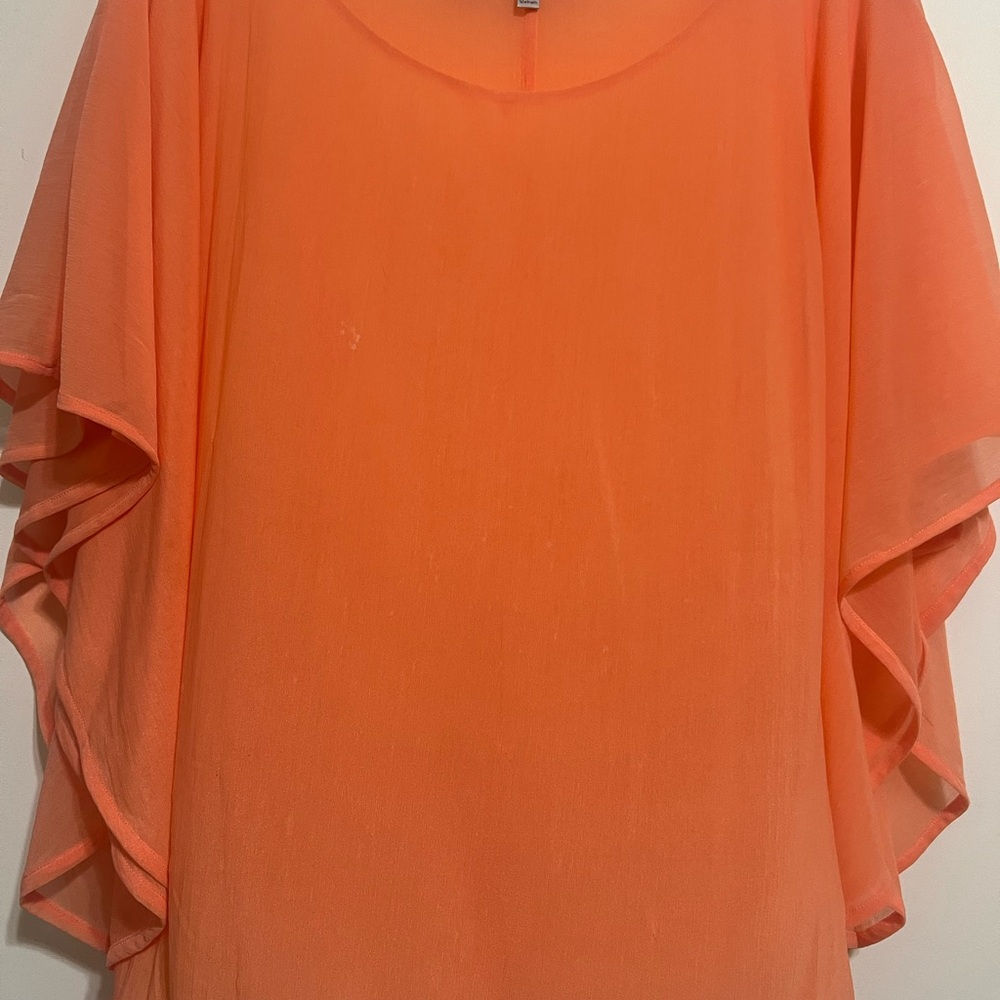 Jennifer Lopez Vibrant Orange Blouse with Flutter Sleeves